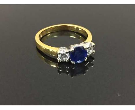 An 18ct gold two stone diamond and sapphire ring, size K. CONDITION REPORT: Good conditions.