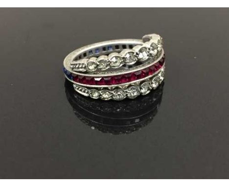 A vintage silver swivel eternity ring, 4.1g, size M. CONDITION REPORT: Good condition, swivels both to red and blue stones.