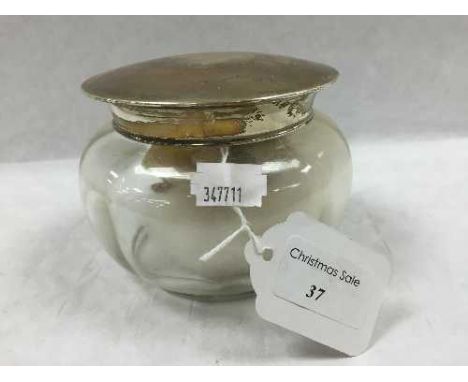 A silver topped glass dressing table jar, Birmingham 1926, height 9 cm. CONDITION REPORT: Good condition to glass and silver,