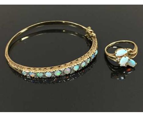 A 9ct gold opal and diamond bracelet, diameter 6 cm x 5.6 cm, together with a 9ct opal and diamond ring, size O/P. (2) CONDIT