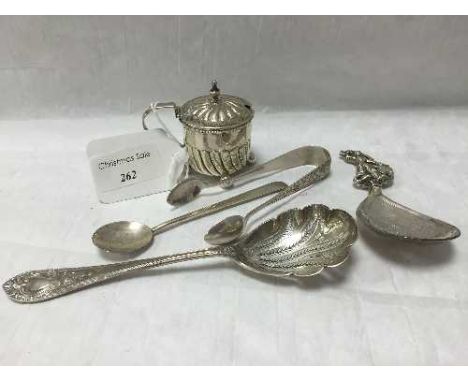 A silver caddy spoon, import marks London 1897, together with a silver straining spoon, silver mustard pot with liner, sugar 