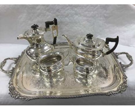 A four piece Sheffield plate tea service on tray with scalloped edge design. (5) CONDITION REPORT: Excellent condition and ex