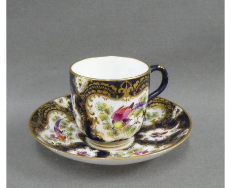 Royal Worcester porcelain cabinet cup and saucer painted with birds and insects to a blue and gilt ground, signed Johnson, wi