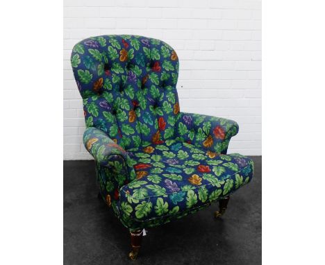 Button back upholstered armchair on castors, 102 x 85cm