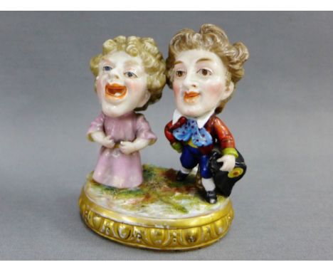 19th century male and female figure group on an oval gilt edged base with Derby style red crown back stamp, 9.5cm high