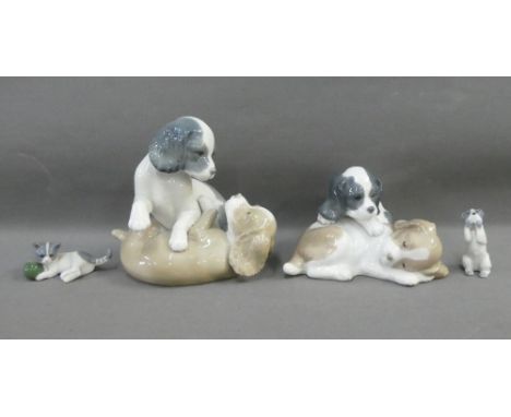 Two Nao Spanish porcelain Dog figure groups, together with an unmarked Dog and Kitten, (4) 