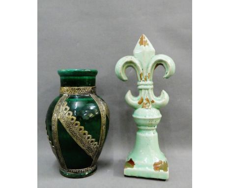 Green glazed pottery Fleur de Lys together with a white metal mounted vase, (2) 