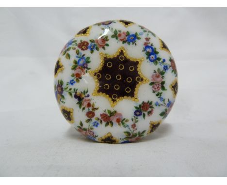 A French enamel box, decorated in Sevres style with a flower form reserve containing a bouquet of Summer flowers with tooled 