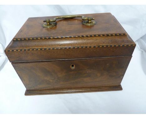 A  walnut veneer tea caddy, of stepped sarcoghagus form, boxwood stringing to the corner, the hinged cover with large brass u