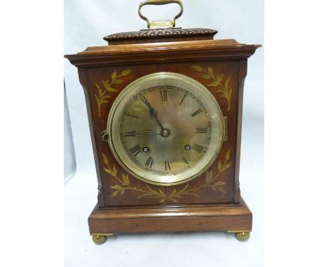 A J W Benson mantel clock, the arched top case containing a silvered dial, the case with marquetry spandrels, striking moveme