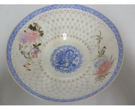 A Chinese eggshell porcelain bowl, the body decorated with translucent circular motifs in the manner of rice grain porcelain,