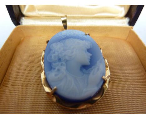 A cameo glass pendant, oval cut with a portrait of a young girl in profile, within a 18ct yellow gold mount, suspension loop 