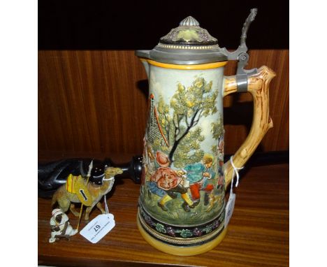 A late-19th/early-20th century Simon Peter Gerz pewter-lidded stoneware jug, the body with raised rustic scene decoration of 