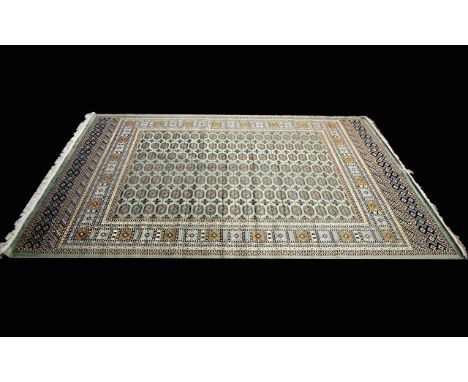 A Very Large Woven Silk Bokhara Carpet Ornate silk carpet with traditional lozenge and geometric repeat design with intricate