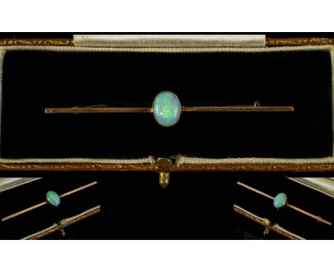 Antique Period 9ct Gold - Opal Set Pin / Stick Brooch of Elongated Shape, The Oval Shaped Opal of Good Colour. Est Size 1.25 