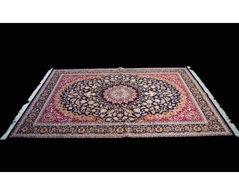 A Very Large Woven Silk Carpet Keshan rug with cobalt blue ground and traditional Middle Eastern floral and foliate border de