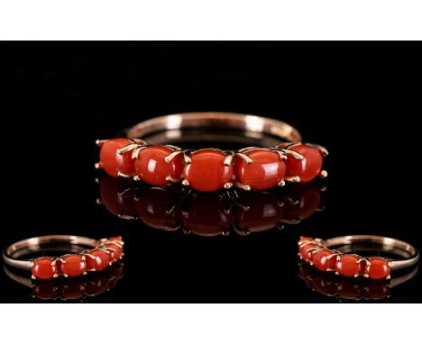 Natural Coral Band Ring, five oval cabochons of natural coral from the Mediterranean, totalling 2cts, set in a row in rose go