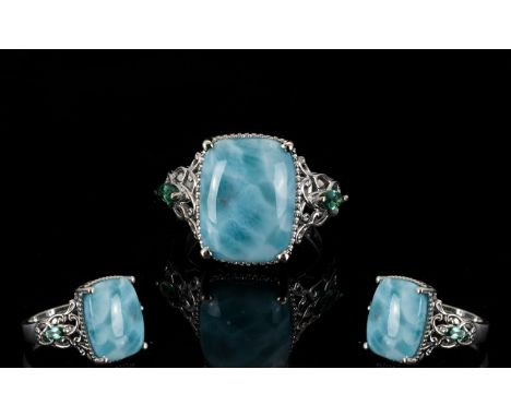 Larimar Solitaire Ring with Ocean Blue apatite accents; an 11.75ct curved rectangular larimar cabochon with a milgrain frame,