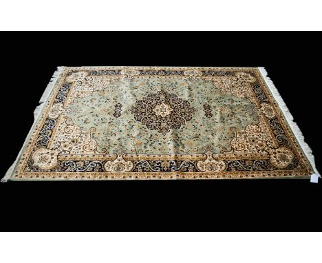 A  Large Woven Silk Carpet Keshan rug with Eau De Nil ground and traditional Middle Eastern floral and foliate border detail 