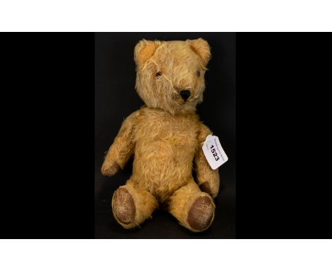 A Vintage Jointed Teddybear Circa 1920's fully jointed, stuffed with straw, growl no longer functioning. brown painted paw pa