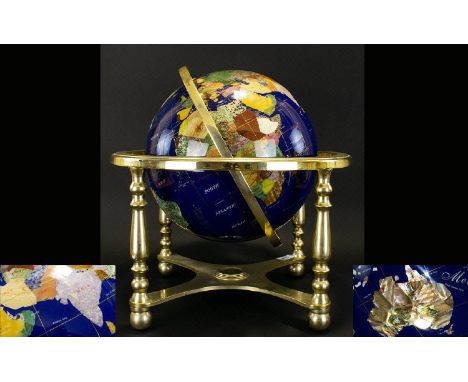 Decorative Gemstone Globe Gilt framed Globe inlaid with various semi precious stones and gold tone lines of latitude and long