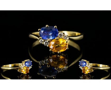 Ladies 18ct Gold Attractive Two Stone Sapphire and Diamond Dress Ring the blue sapphire and orange/yellow sapphire flanked by