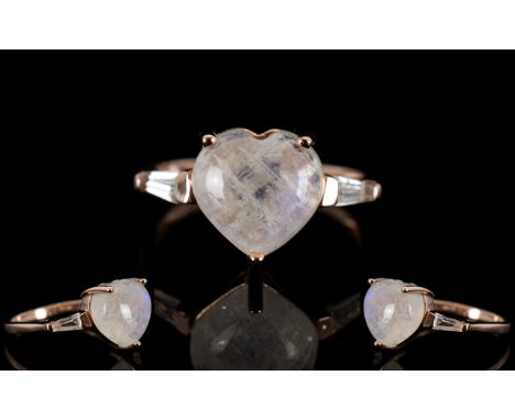 Rainbow Moonstone Heart Cut Ring, a 5ct heart cut rainbow moonstone cabochon, mined in Sri Lanka, accented by a white topaz t