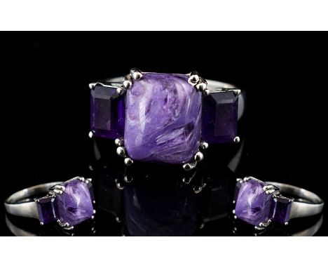 Russian Charoite and Amethyst Ring, a 5ct octagon cut cabochon of the unusual Russian stone, charoite, named for the river wh