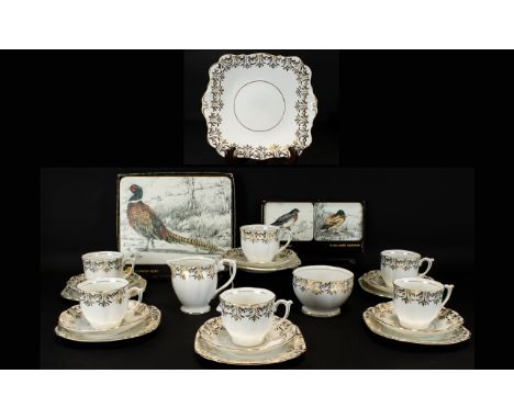 Bell China Tea Service - bone china tea service in white with gold pattern trim.  Comprises; 6 cups, 6 saucers, 6 side plates