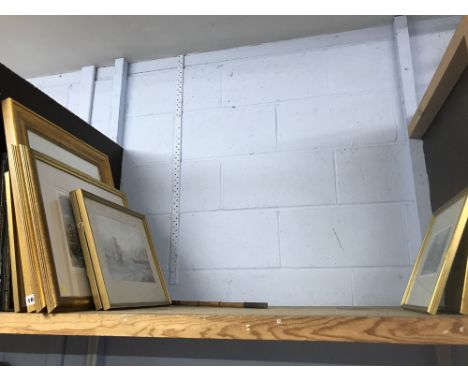 Shelf of various pictures and a walking stick