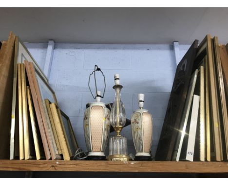 Shelf of prints and lamps