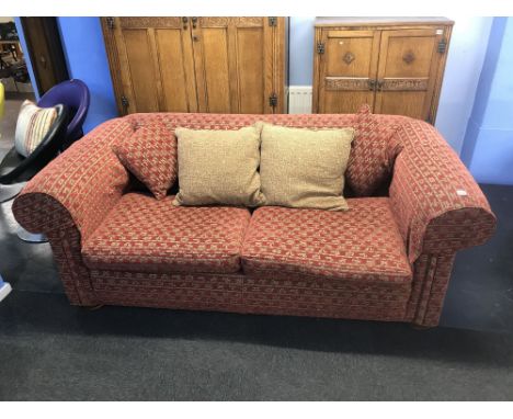 A large Chesterfield style roll end three seater settee