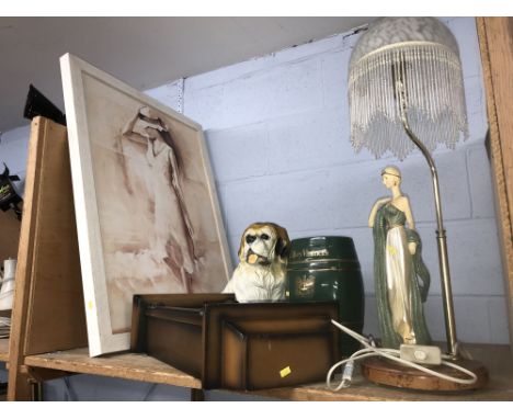 Shelf consisting of a lamp, clock and a picture