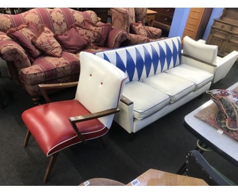 A vintage blue and white three seater settee and two armchairs