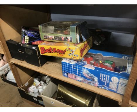 Shelf of boxed and loose toys