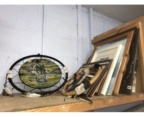 Shelf of tribal prints and a large dream catcher
