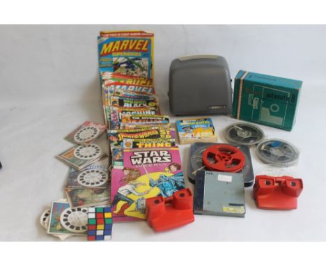 TWO VIEWMASTER VIEWERS AND A SMALL SELECTION OF REELS, together with a Rubiks Cube, a quantity of 1970s/1980s Marvel comics, 