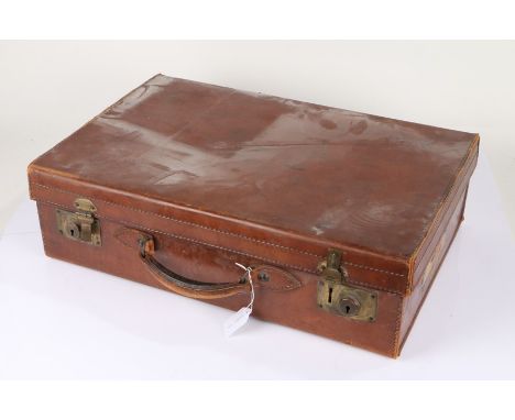 Trunk Department brown leather suitcase, the underside lid with makers label 'By Special Appointment To His Majesty The King'