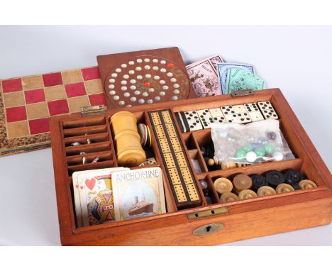 An early 20th Century mahogany Games Compendium with folding leather chess/backgammon board, six lead race horses and track, 