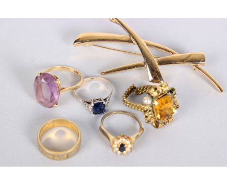 A 9ct gold and amethyst coloured stone ring, 9ct white gold ring, three costume rings and a brooch