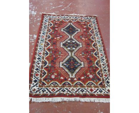 A Turkish carpet 150 x 77cm 