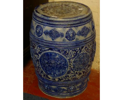 A Continental blue glazed ceramic garden seat decorated with lion masks 56cm high 