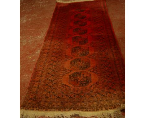 An Afghan carpet 107cm x 270cm 