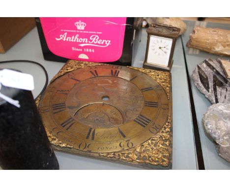 A brass dial and mechanism Henry Deeme, Honiton, the square brass dial, engraved and with spandrels and a carriage clock 