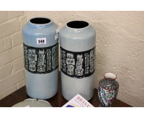 A pair of Claycraft vases, turquoise with panel border of abstract faces, 31cm high, a ceramic crab and a small vase (4)