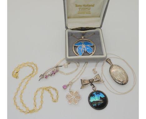 A silver butterfly wing pendant brooch, a silver and enamel flower pendant and other items Condition Report: Not available fo
