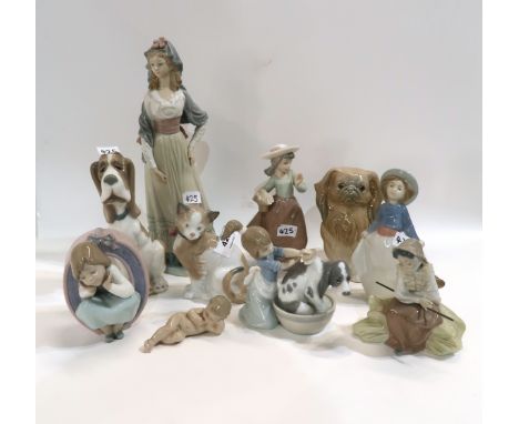 A collection of Lladro and Nao figures, mainly children and animals Condition Report: all in good condition. 