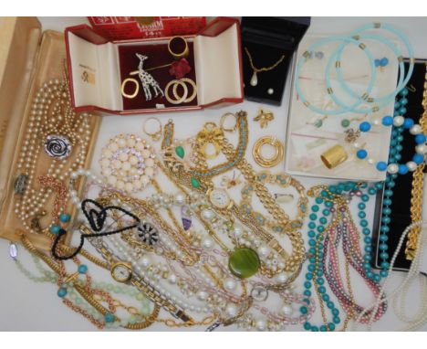 A collection of vintage costume jewellery to include a silver watch, and a giraffe brooch Condition Report: Not available for