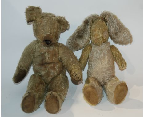 An early Chad Valley Aerolite Teddy bear, lacking eyes, (af) 43cm high and bunny rabbit soft toy, 50cm high (2) Condition Rep