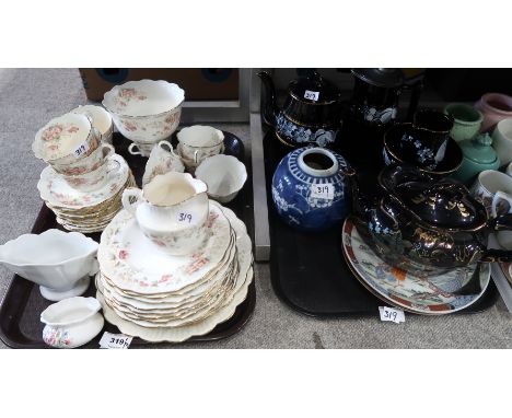 A lot comprising a Victorian hand painted part tea service decorated with swags of pink flowers and foliage, black ground gil